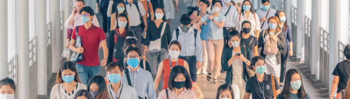 People walking in group wearing masks